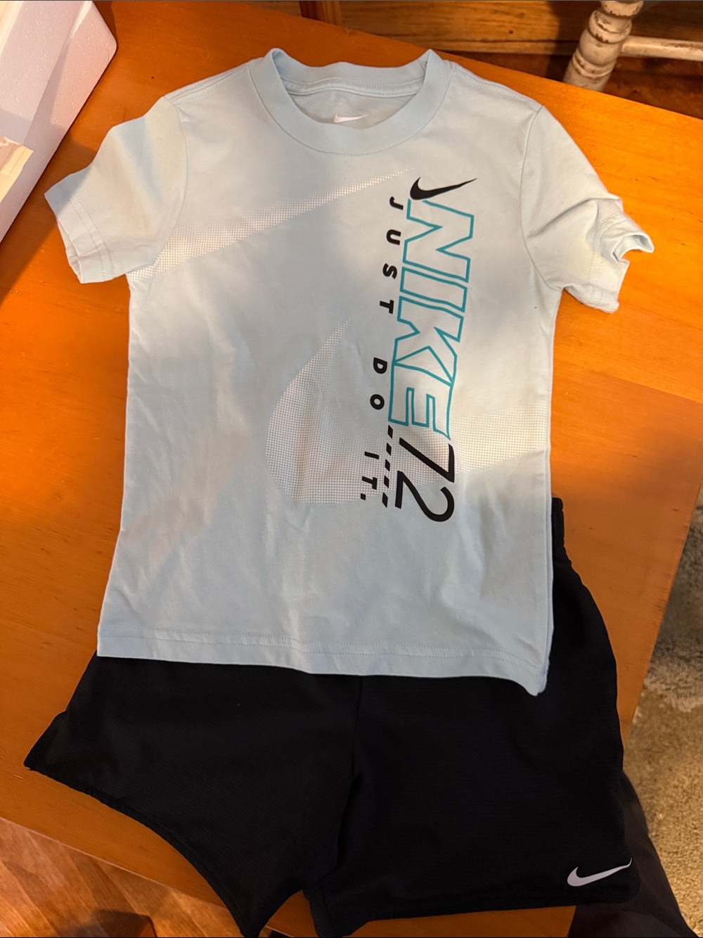 Nike Light Blue Graphic Tee with Black Athletic Shorts